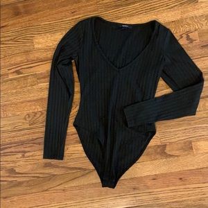 Black V neck ribbed long sleeved body suit. S
